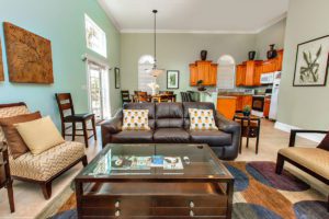 Living room with brown couches and chairs