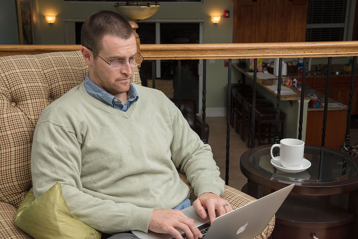 man-on-computer Man on computer