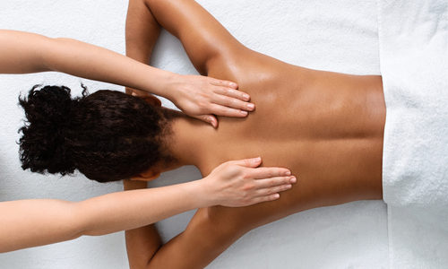 Slim,Black,Woman,Receiving,Full,Body,Massage,At,Modern,Spa,